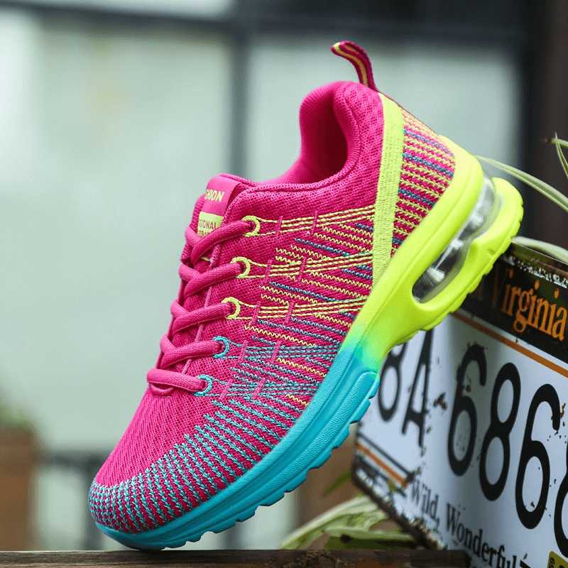 Stylish bright mesh women's sneaker with breathable design, vibrant colors, and EVA outsole for comfort and traction.